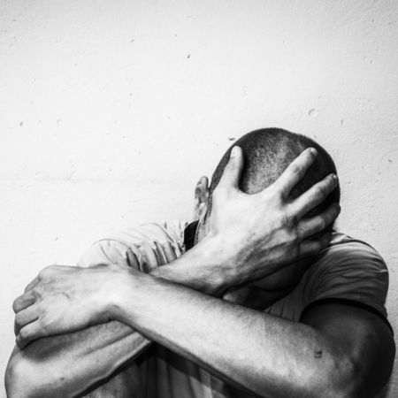 depressed-man-sitting-on-floor