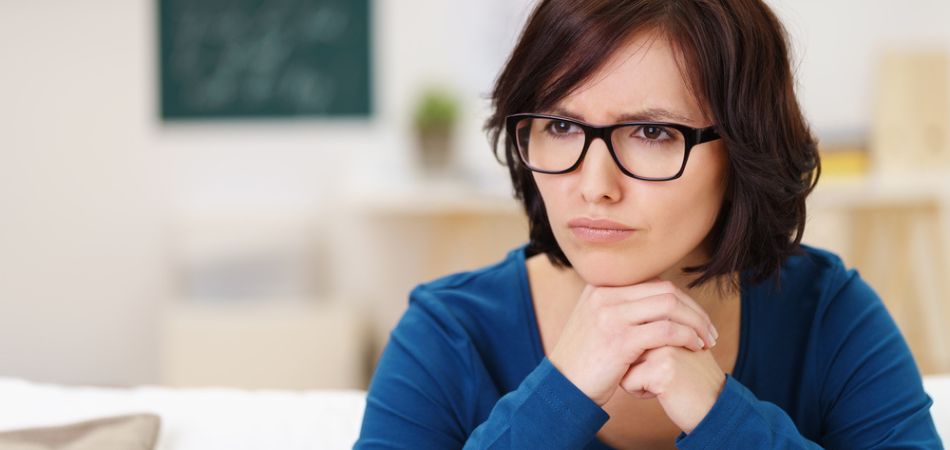 young sober woman thinking